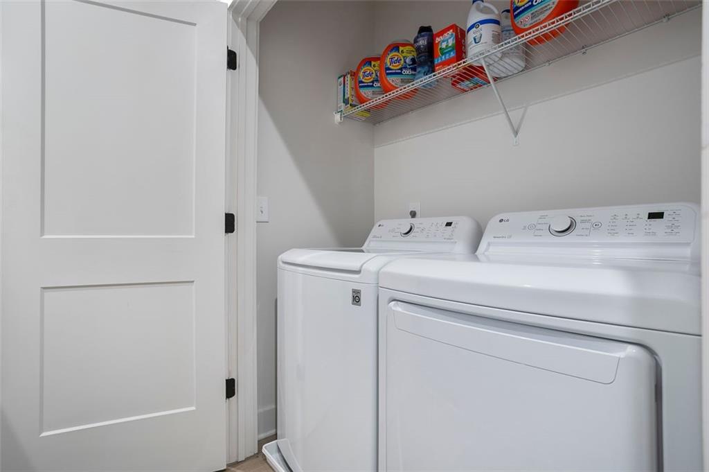 1081 Crest Circle Southeast Atlanta, GA 30312 - Photo 11 of 26 a utility room with dryer and washer