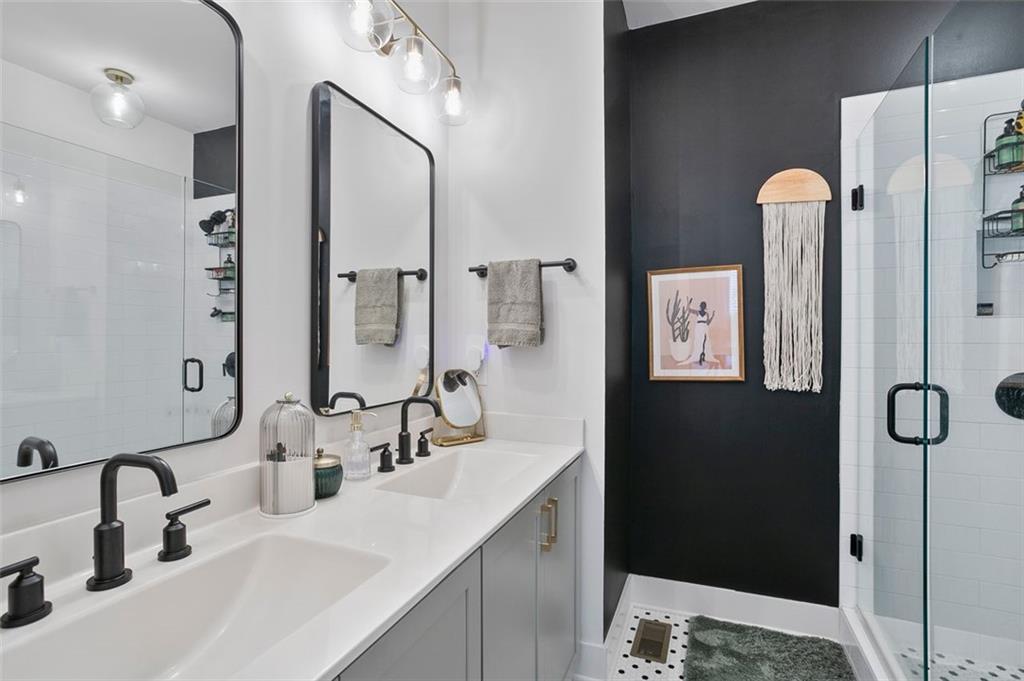 1081 Crest Circle Southeast Atlanta, GA 30312 - Photo 16 of 26 a bathroom with a double vanity sink and mirror