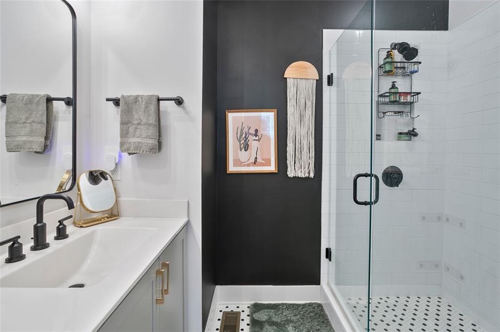 1081 Crest Circle Southeast Atlanta, GA 30312 - Photo 17 of 26 a bathroom with a sink and mirror