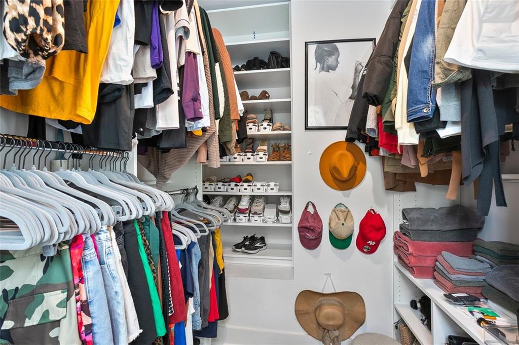 1081 Crest Circle Southeast Atlanta, GA 30312 - Photo 18 of 26 a view of walk in closet with clothes and shoes