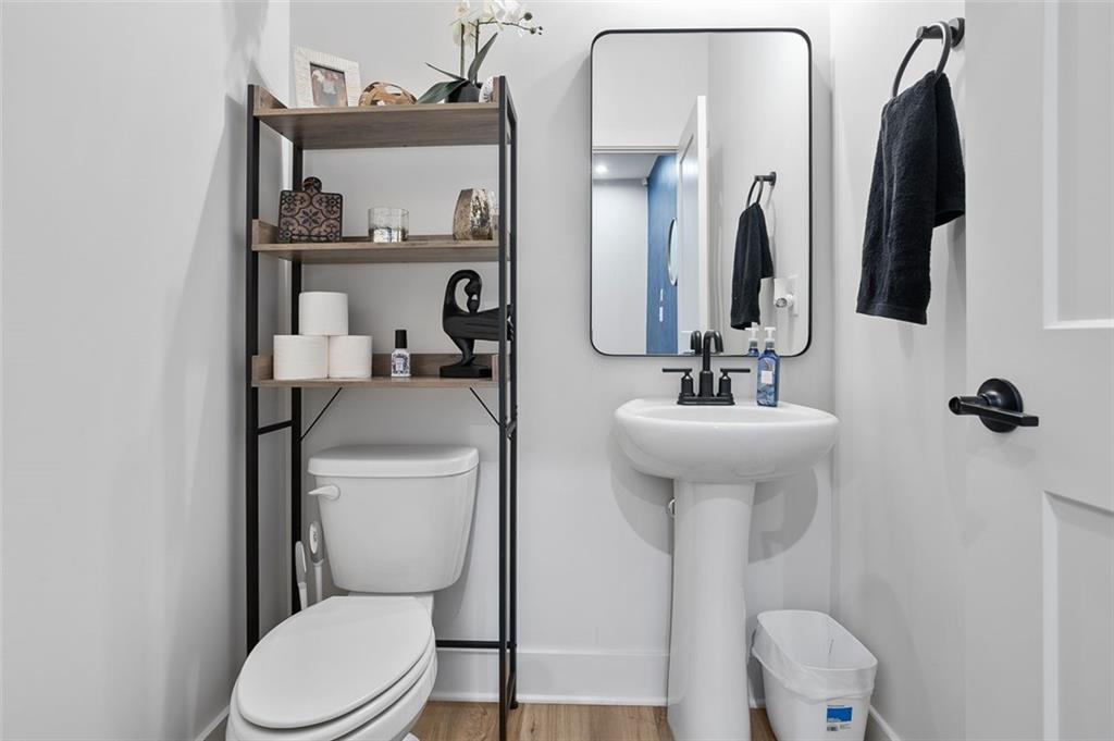 1081 Crest Circle Southeast Atlanta, GA 30312 - Photo 20 of 26 a bathroom with a toilet sink and mirror