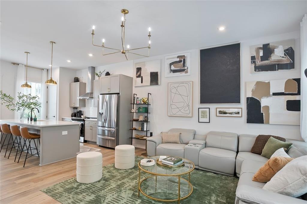 1081 Crest Circle Southeast Atlanta, GA 30312 - Photo 2 of 26 a living room with furniture and kitchen view