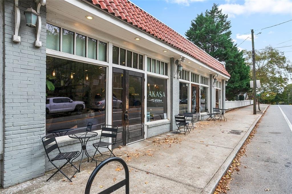 1081 Crest Circle Southeast Atlanta, GA 30312 - Photo 24 of 26 a view of a patio with table and chairs and floor to ceiling window