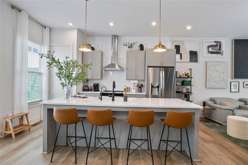 1081 Crest Circle Southeast Atlanta, GA 30312 - Photo 6 of 26 a large kitchen with a table and chairs