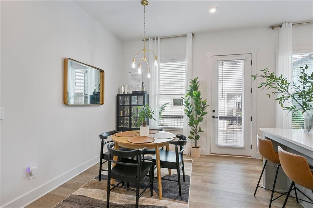 1081 Crest Circle Southeast Atlanta, GA 30312 - Photo 7 of 26 a view of a dining room with furniture and wooden floor
