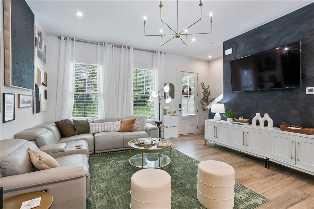 1081 Crest Circle Southeast Atlanta, GA 30312 - Photo 8 of 26 a living room with furniture a flat screen tv and kitchen view