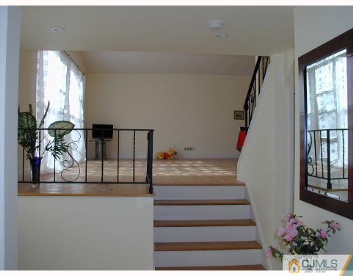 33 Allwood Road East Brunswick, NJ 08816 - Photo 6 of 8 a view of entryway and hall
