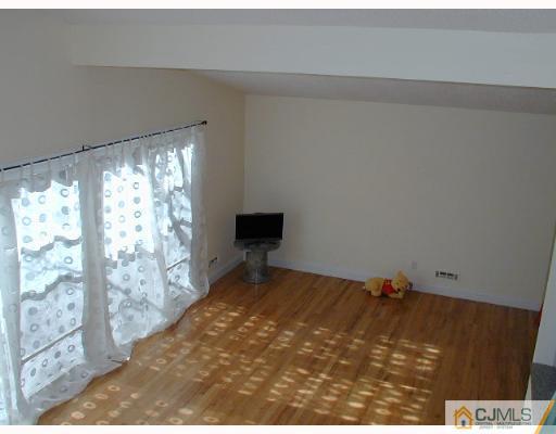 33 Allwood Road East Brunswick, NJ 08816 - Photo 8 of 8 a bedroom with a bed and a window
