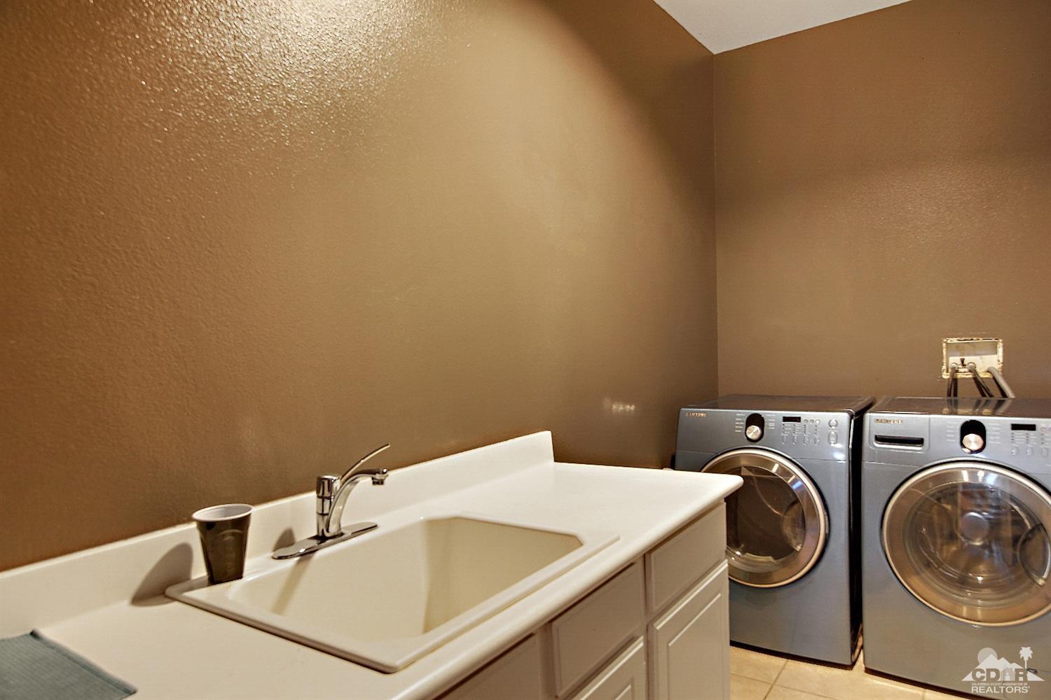 82734 Mount Riley Drive Indio, CA 92203 - Photo 11 of 26 a utility room with dryer and washer