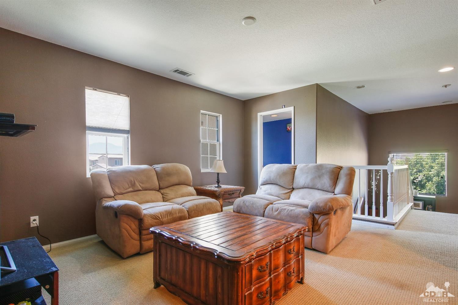 82734 Mount Riley Drive Indio, CA 92203 - Photo 14 of 26 a living room with furniture and a window