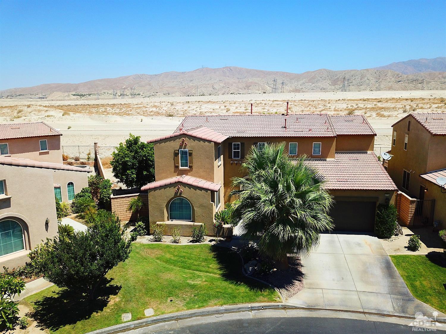 82734 Mount Riley Drive Indio, CA 92203 - Photo 22 of 26 a view of a lake with a mountain
