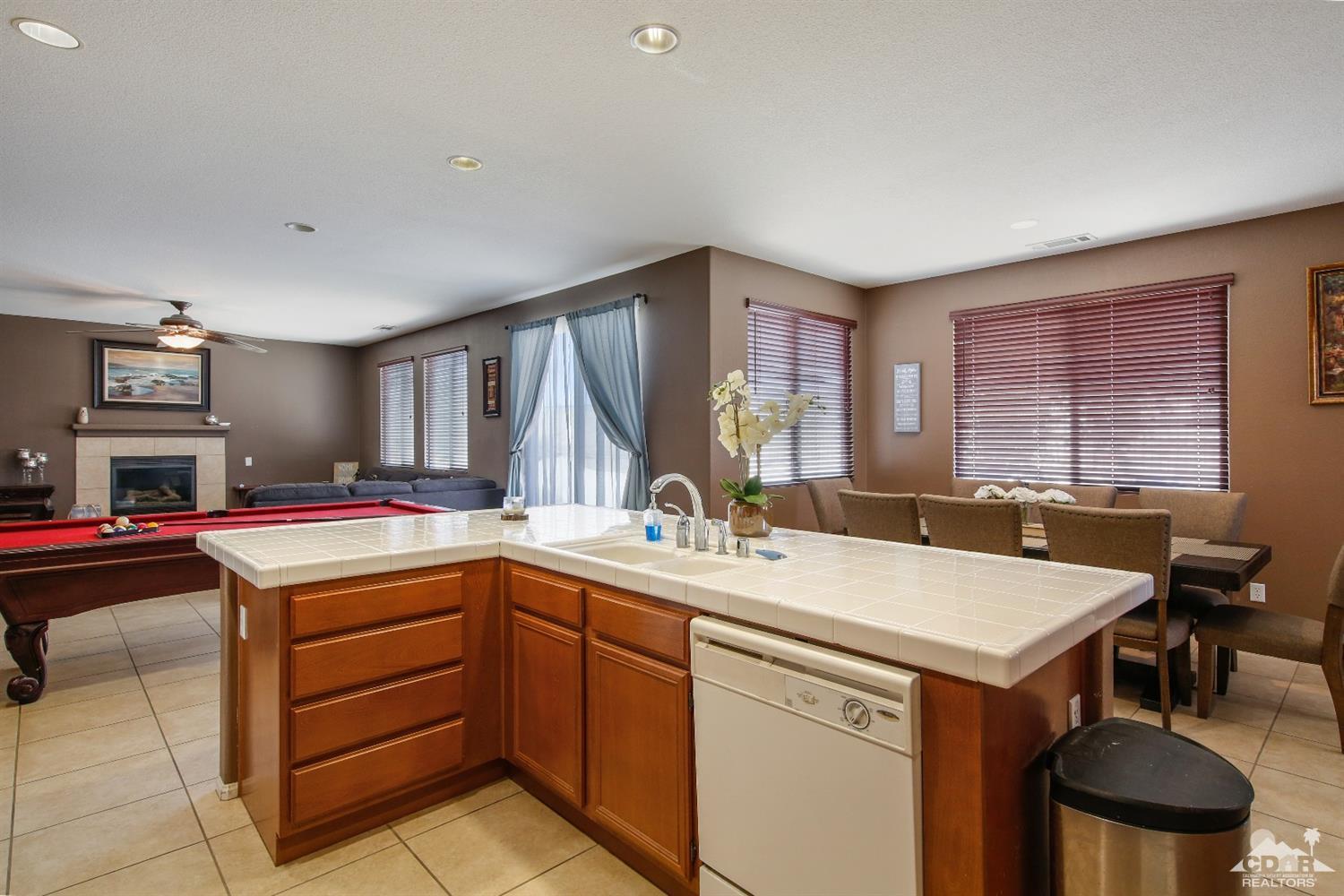 82734 Mount Riley Drive Indio, CA 92203 - Photo 8 of 26 a kitchen with a stove and a sink