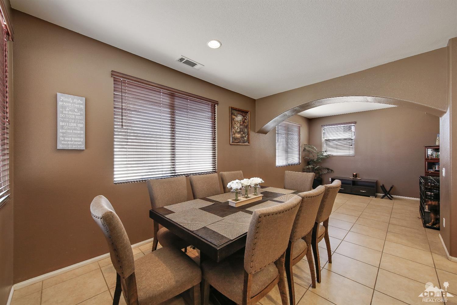 82734 Mount Riley Drive Indio, CA 92203 - Photo 9 of 26 a view of a dining room with furniture and window
