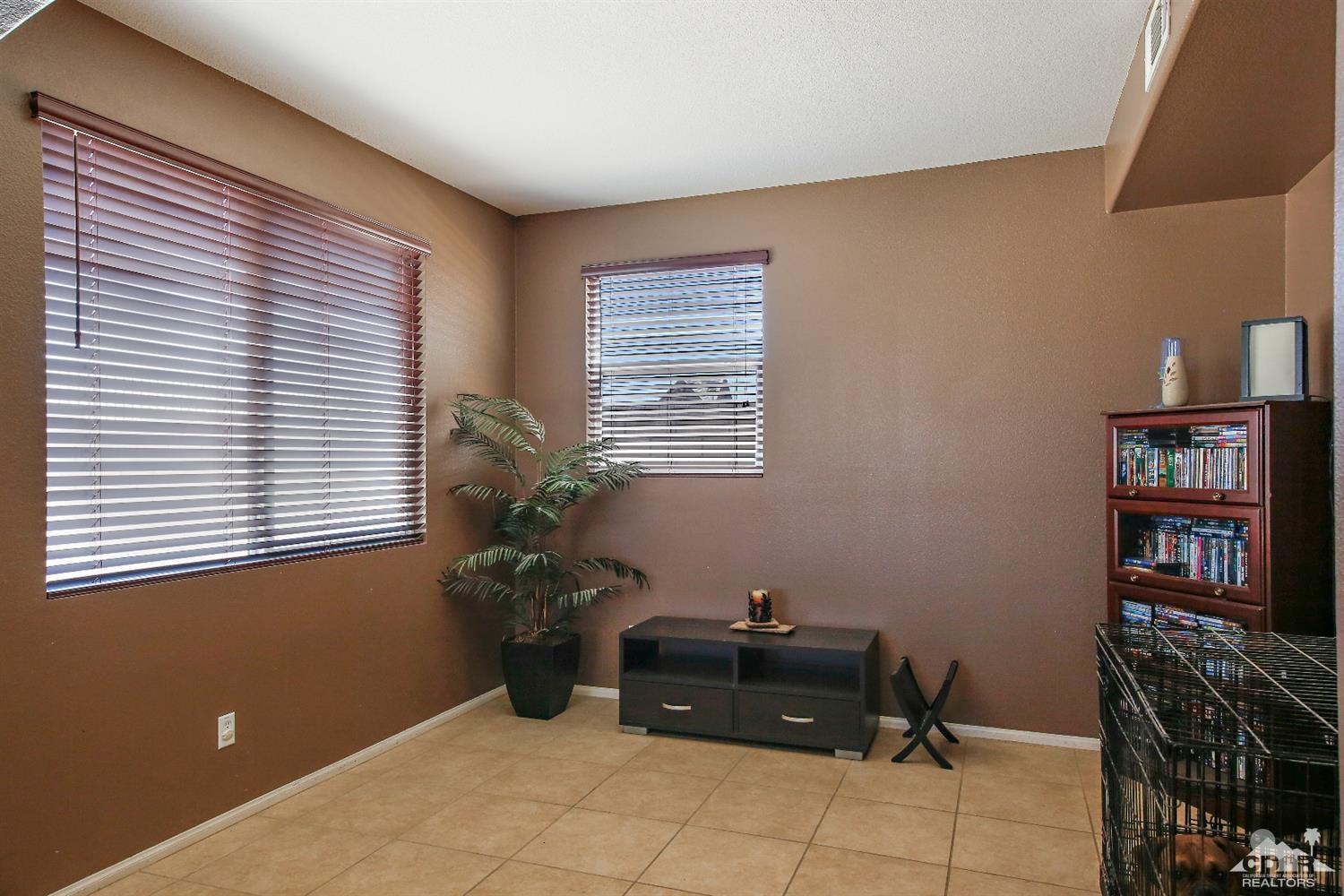 82734 Mount Riley Drive Indio, CA 92203 - Photo 10 of 26 a room with furniture and a window