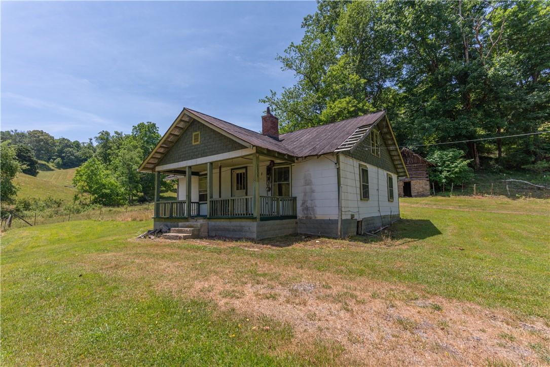 2854 Rabbit Skin Road Waynesville, NC 28785 - Photo 25 of 29 a front view of house with yard and green space