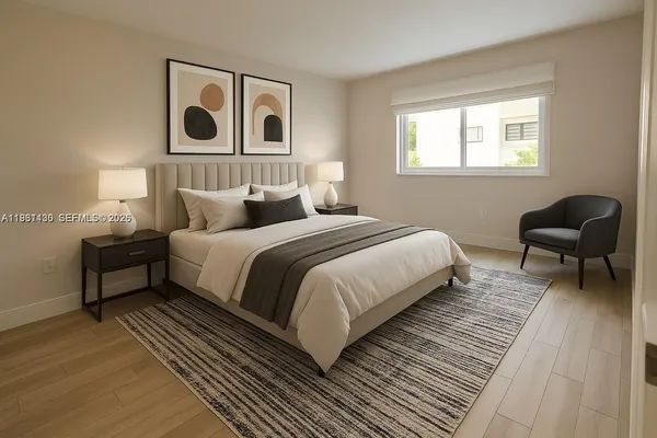 a bedroom with a bed and a chair