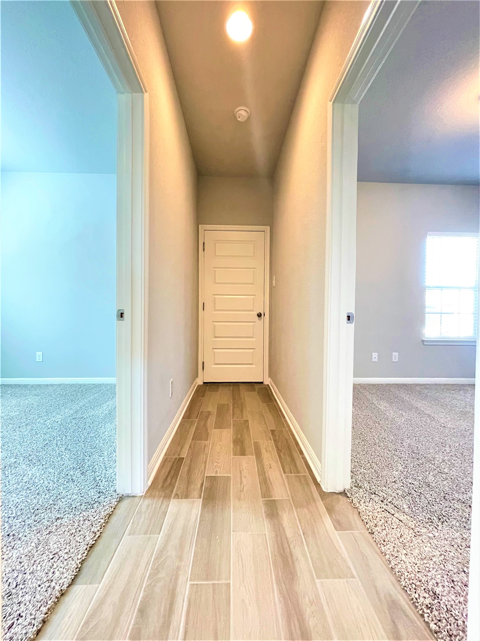 152 Old Stagecoach Road Jarrell, TX 76537 - Photo 13 of 21 Hall with light colored carpet and wood finish floors