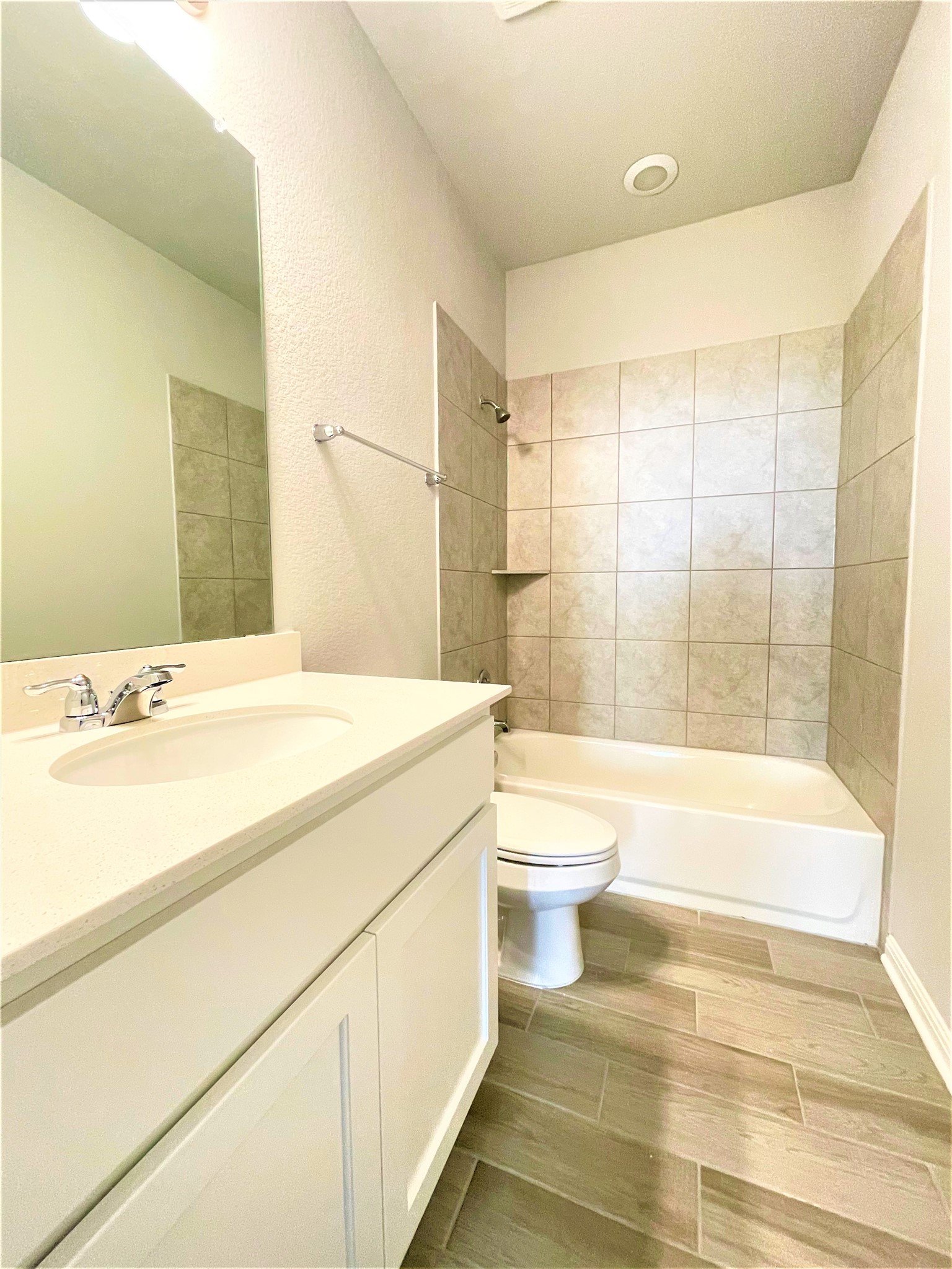 152 Old Stagecoach Road Jarrell, TX 76537 - Photo 16 of 21 Bathroom with vanity, shower / bath combination, and wood tiled floors