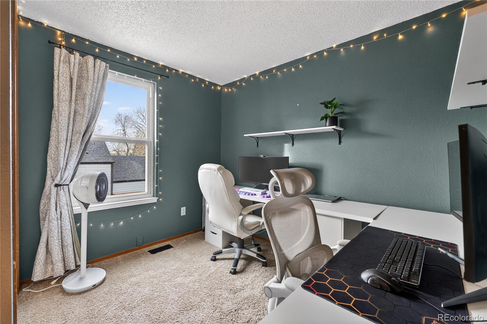 4730 Granby Way Denver, CO 80239 - Photo 21 of 27 a workspace with furniture and a window