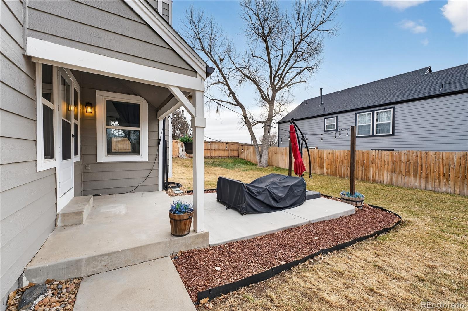 4730 Granby Way Denver, CO 80239 - Photo 22 of 27 a view of a outdoor space with a patio