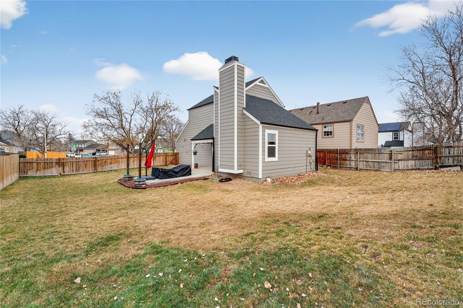 4730 Granby Way Denver, CO 80239 - Photo 23 of 27 a view of a house with a yard