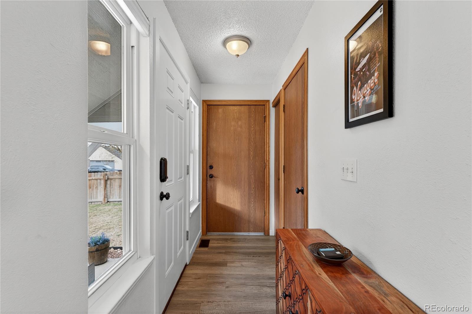 4730 Granby Way Denver, CO 80239 - Photo 5 of 27 a view of a hallway with closet and front door