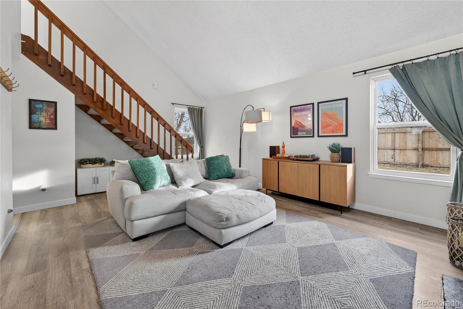 4730 Granby Way Denver, CO 80239 - Photo 8 of 27 a living room with furniture and a window