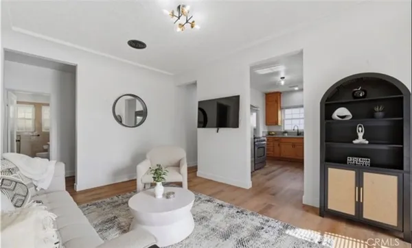 a living room with furniture and a mirror