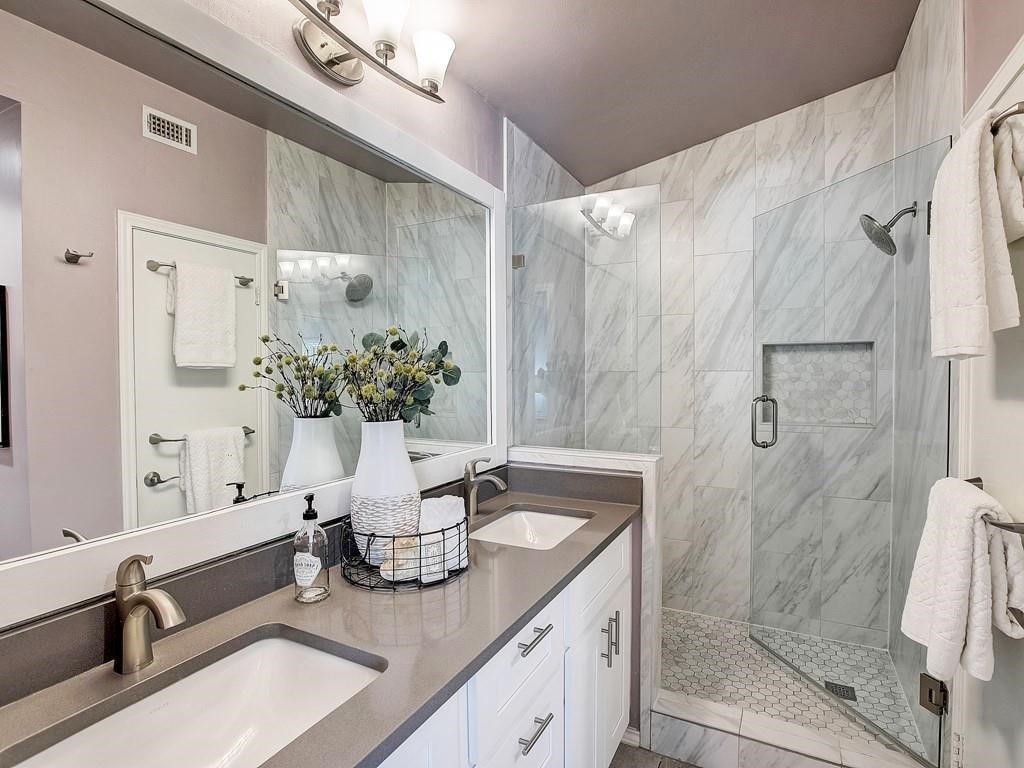 12909 Modena Trail Austin, TX 78729 - Photo 11 of 26 a bathroom with a sink a toilet and shower