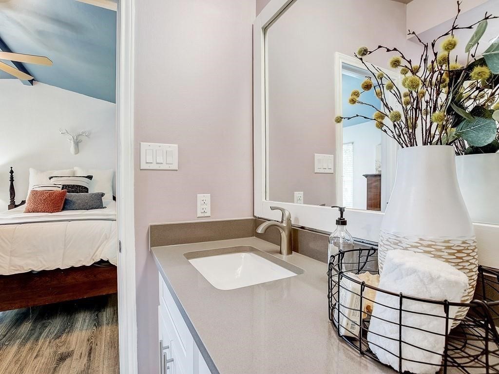 12909 Modena Trail Austin, TX 78729 - Photo 13 of 26 a bath room with a sink and a mirror