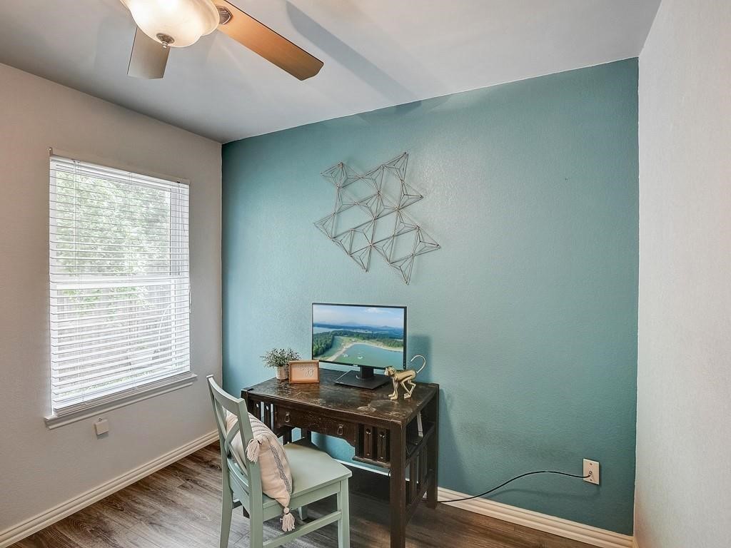 12909 Modena Trail Austin, TX 78729 - Photo 14 of 26 a view of a workspace with furniture and a window