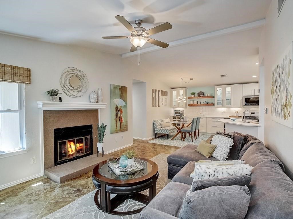 12909 Modena Trail Austin, TX 78729 - Photo 3 of 26 a living room with furniture and a fireplace
