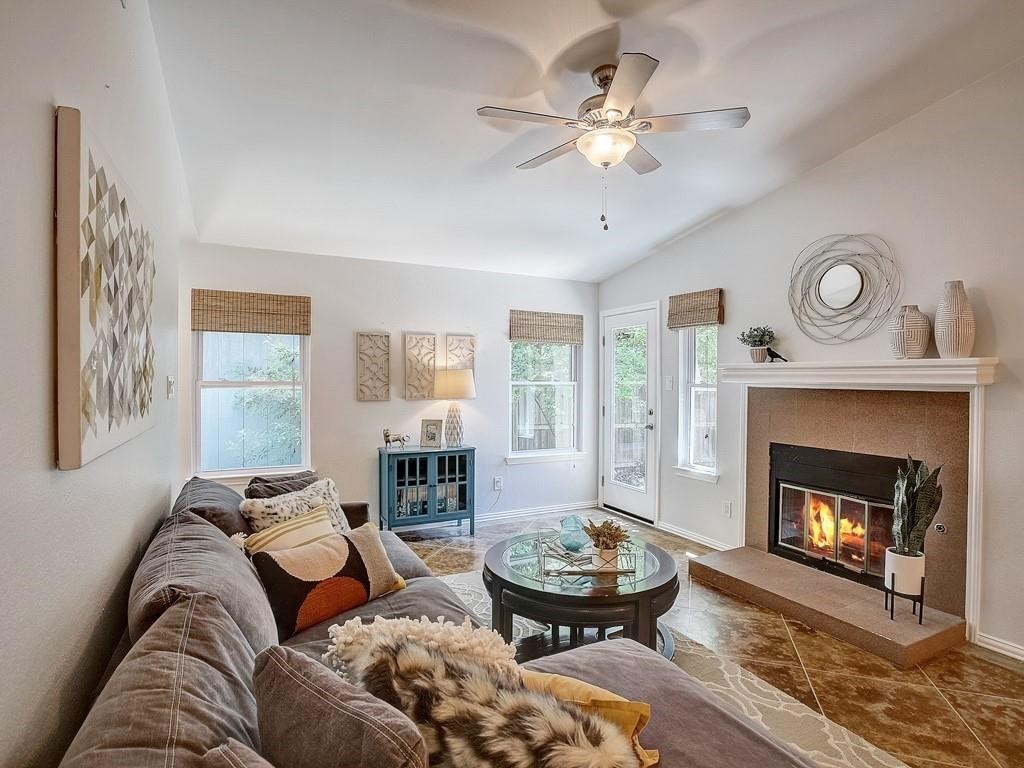 12909 Modena Trail Austin, TX 78729 - Photo 5 of 26 a living room with furniture and a fireplace