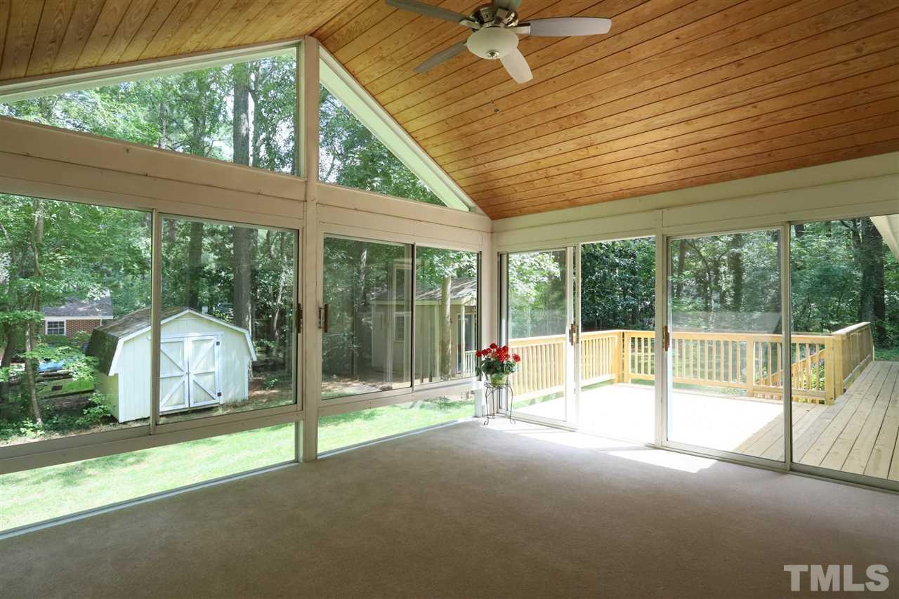 4101 Stranaver Place Raleigh, NC 27612 - Photo 12 of 27 This sunroom allows for extra living space and entertaining. Enjoy the private backyard without the mosquitoes!