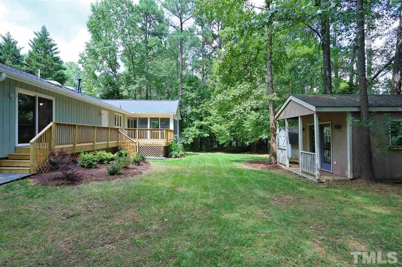 4101 Stranaver Place Raleigh, NC 27612 - Photo 25 of 27 Backyard has two 11x11 storage sheds. The She-Shed is wired and can be used as a detached office.