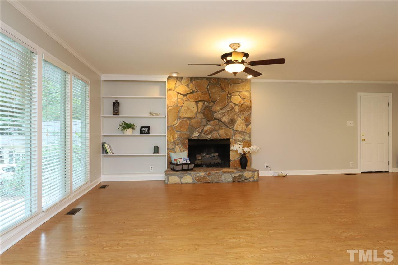4101 Stranaver Place Raleigh, NC 27612 - Photo 4 of 27 Enjoy the gas log fireplace with stone masonry hearth. Large windows offer loads of natural light.