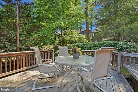 a view of balcony with furniture and trees