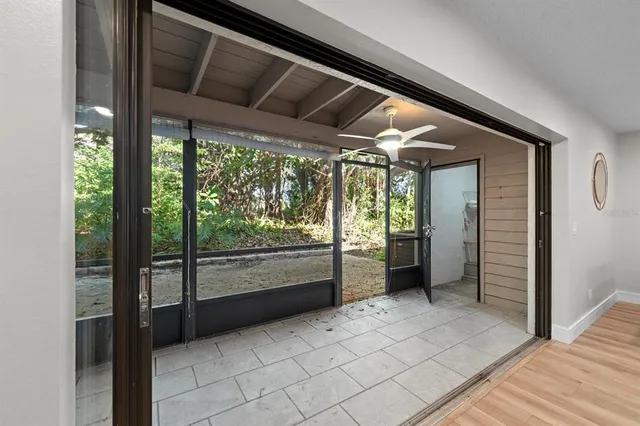a view of an empty room with a window