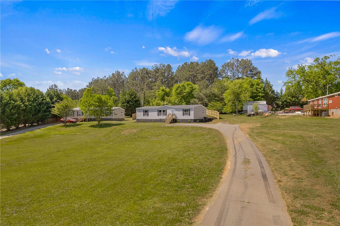 375 Griggs Road Six Mile, SC 29682 - Photo 30 of 36 This expansive lot features multiple homes and a long driveway, offering ample space and privacy.