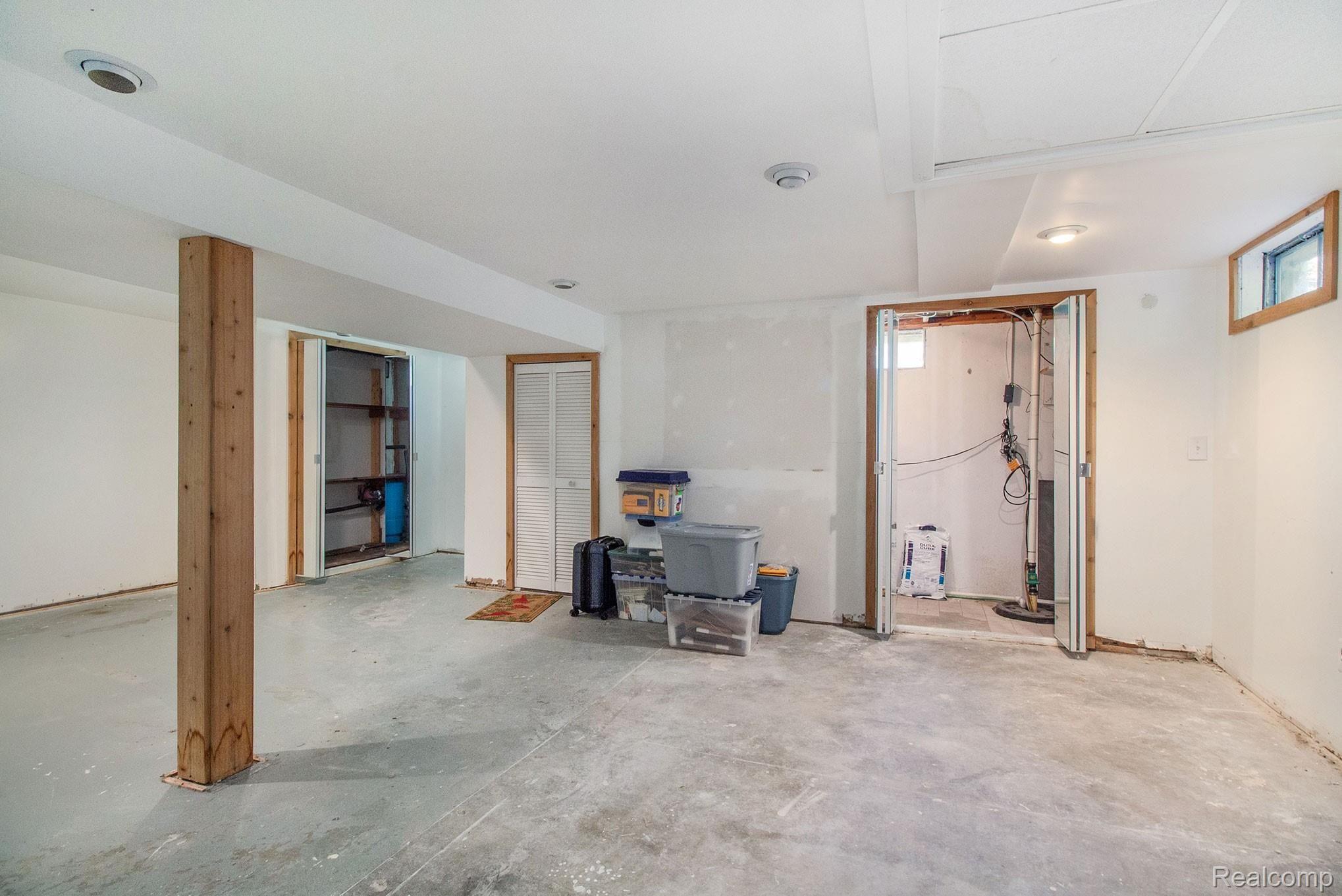 1437 Booth Street Howell, MI 48843 - Photo 13 of 17 Large Partially Finished Basement with Newer Furnace (18 months) and Water Heater (3 years)