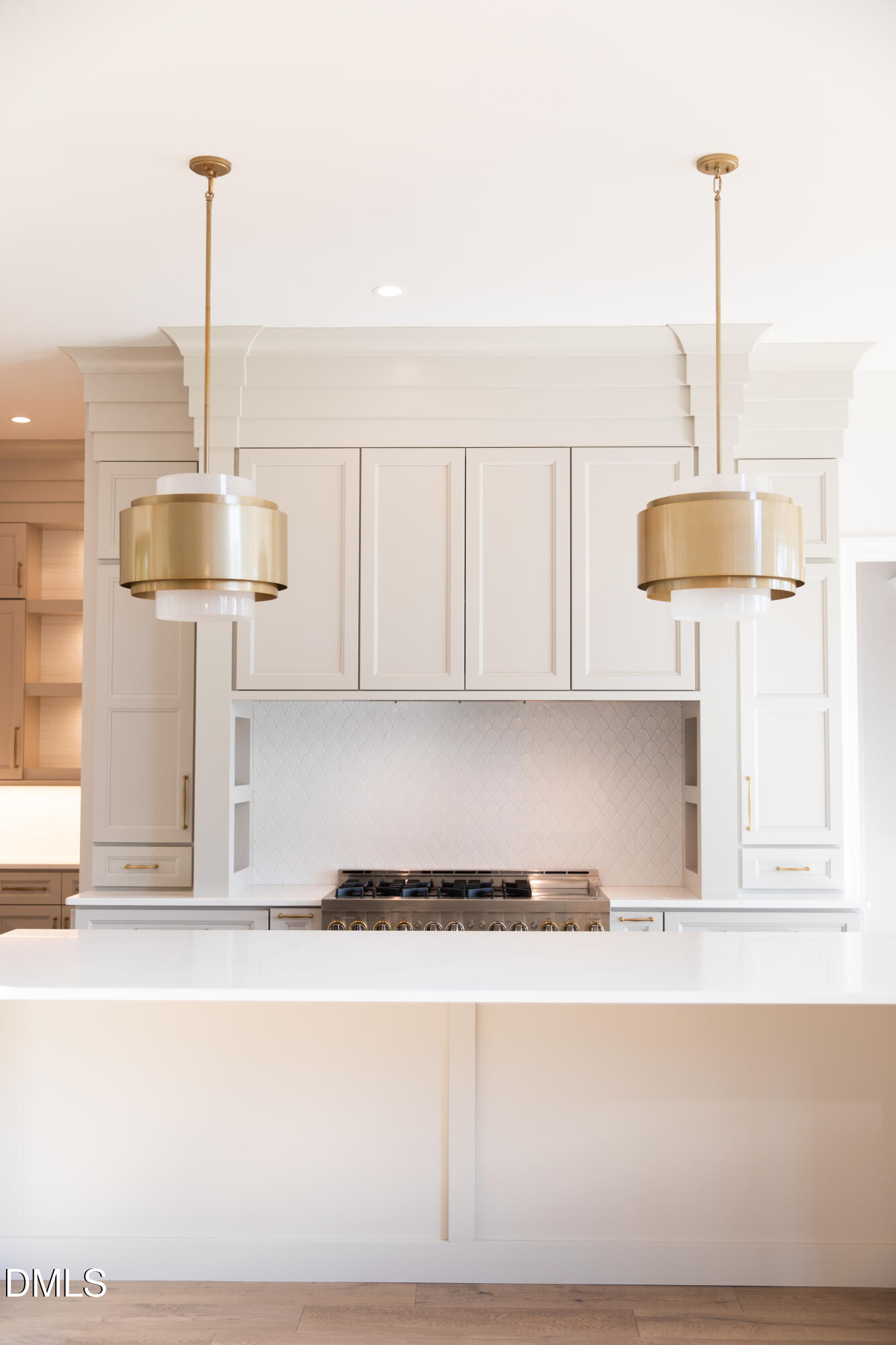 7425 Grist Mill Road Raleigh, NC 27615 - Photo 17 of 57 a kitchen with a sink and chandelier