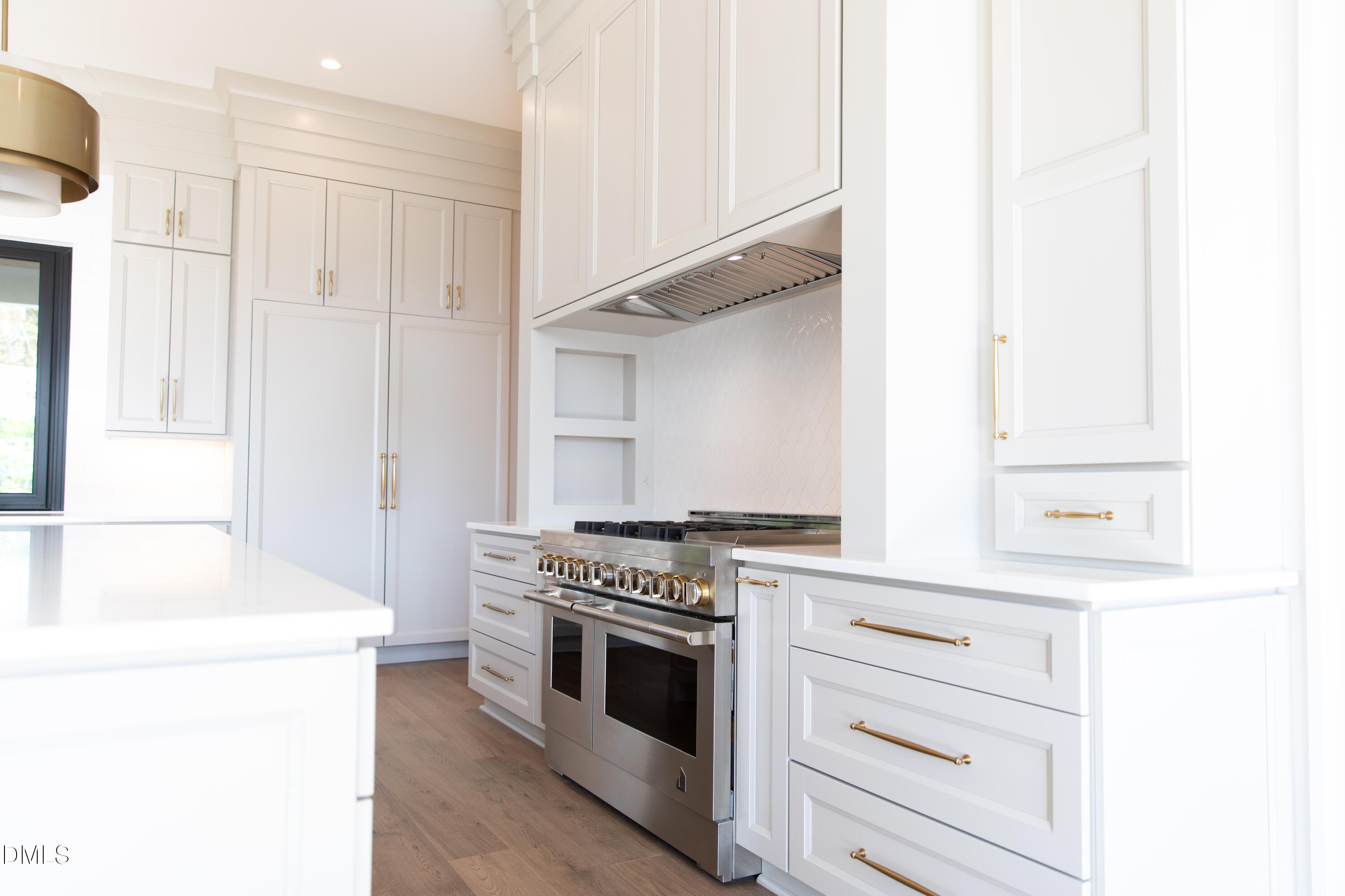 7425 Grist Mill Road Raleigh, NC 27615 - Photo 22 of 57 a kitchen with granite countertop white cabinets and white appliances