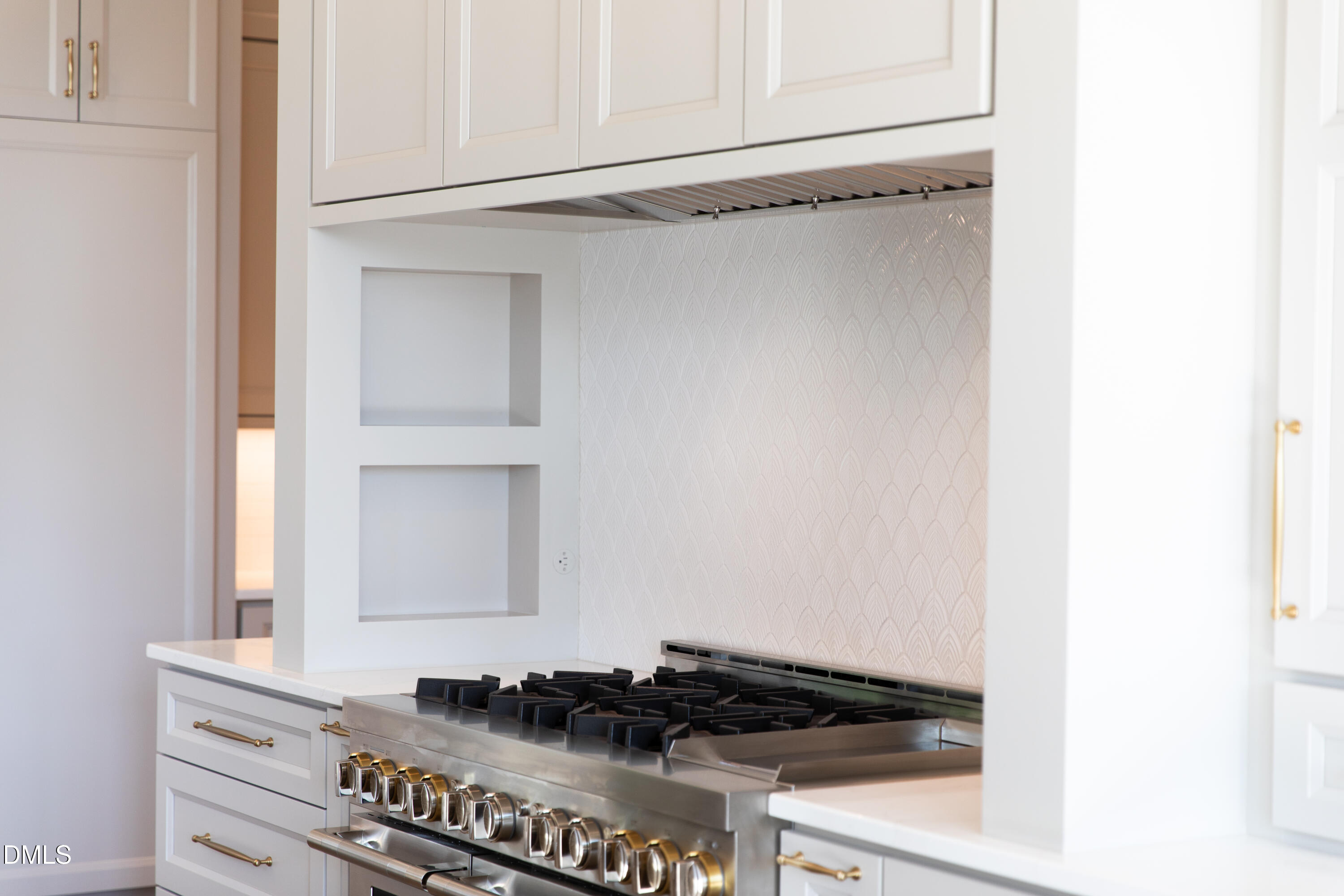 7425 Grist Mill Road Raleigh, NC 27615 - Photo 23 of 57 a close view of a stove top oven and cabinets