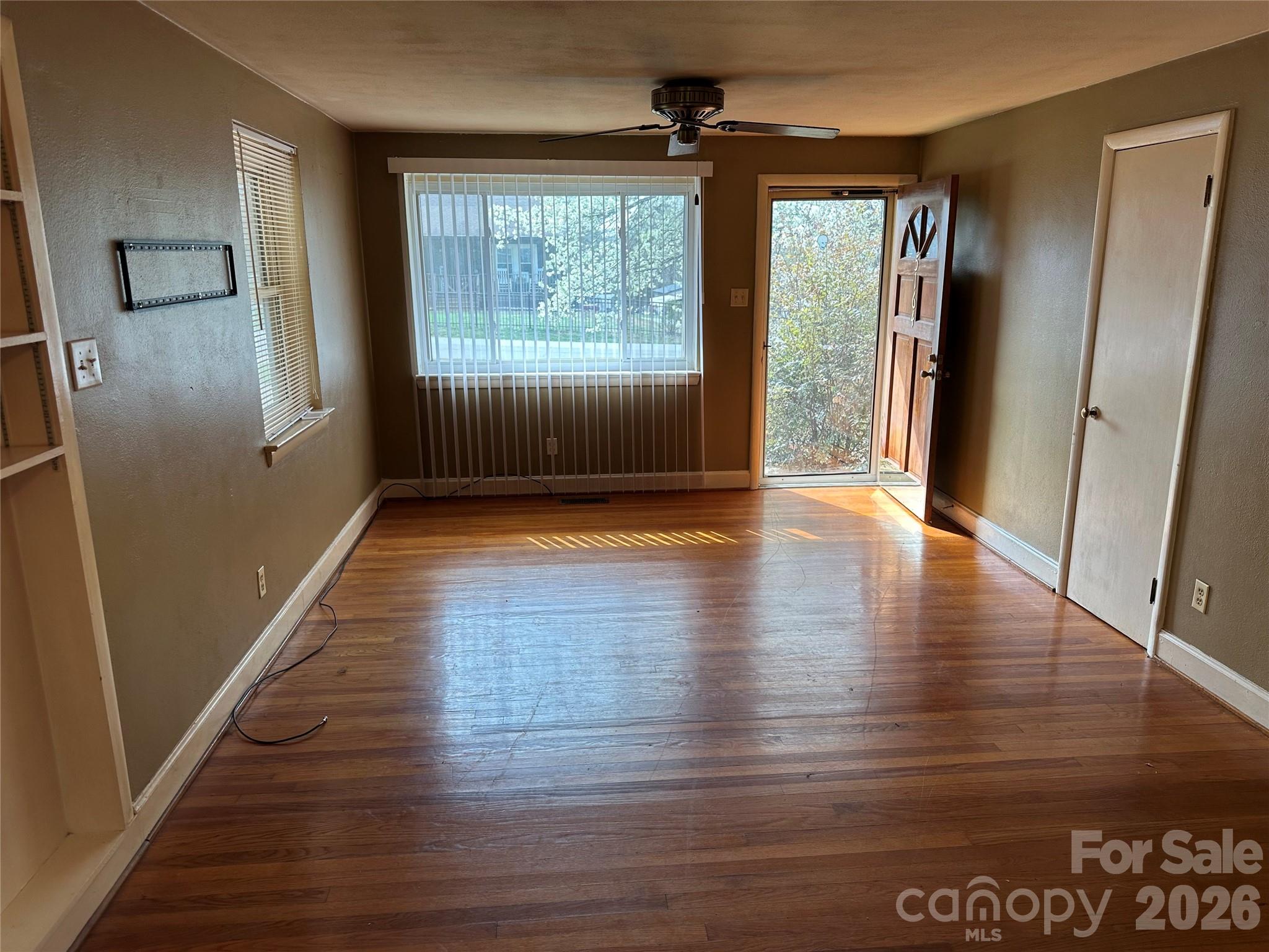5164 Lavern Street, Unit 1 Conover, NC 28613 - Photo 12 of 28 an empty room with wooden floor and windows