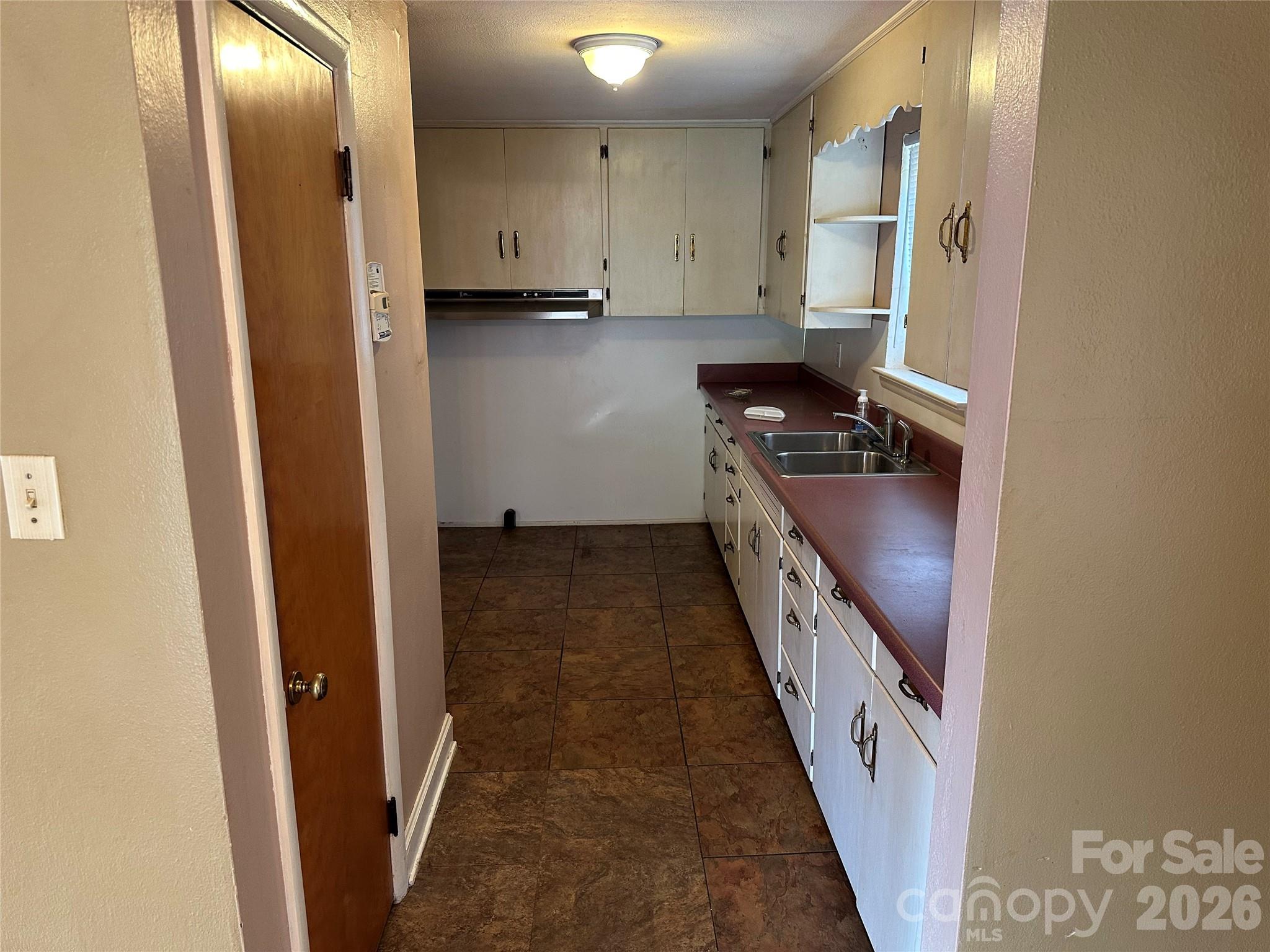 5164 Lavern Street, Unit 1 Conover, NC 28613 - Photo 14 of 28 a kitchen with granite countertop a refrigerator and a stove