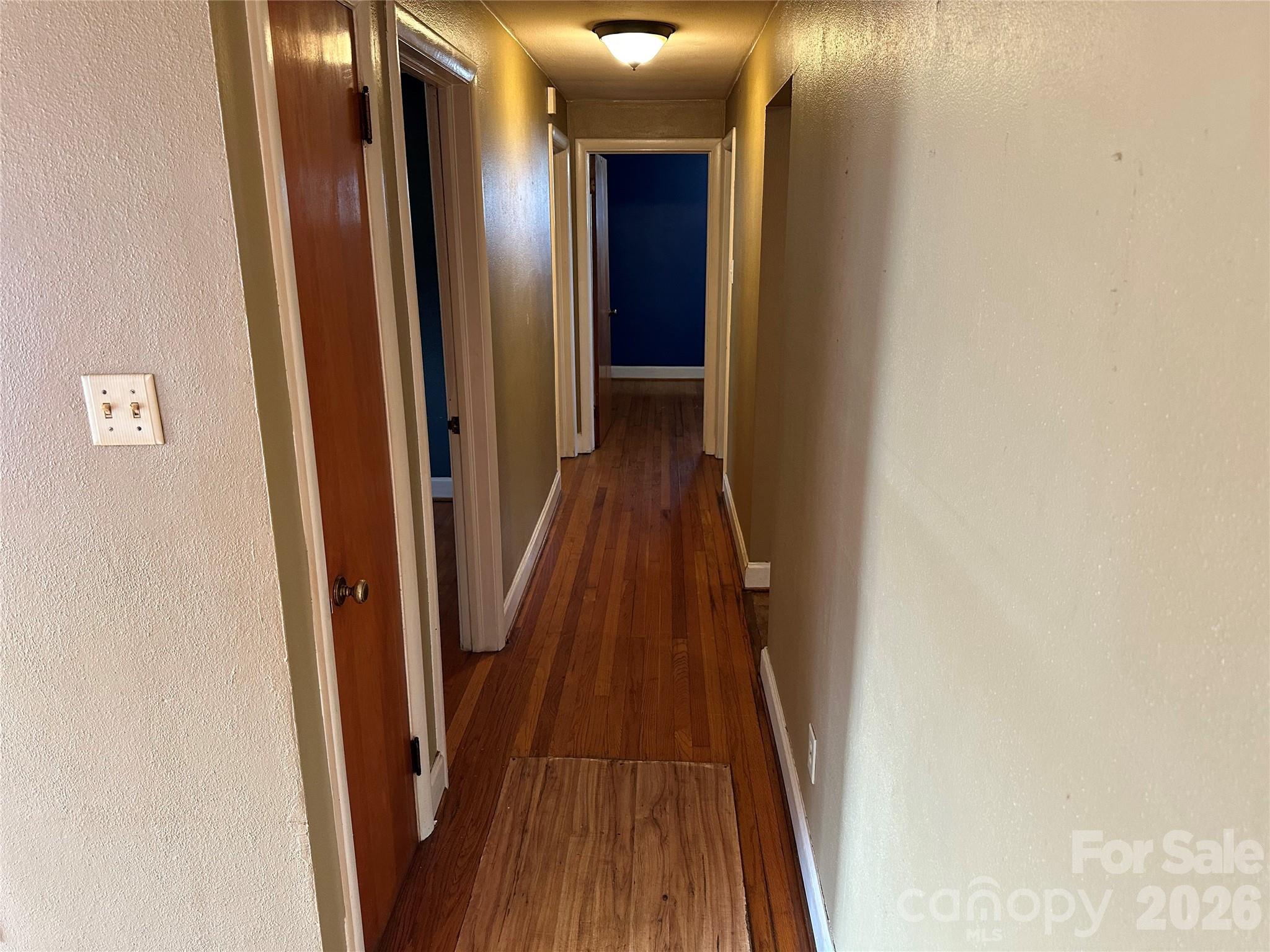 5164 Lavern Street, Unit 1 Conover, NC 28613 - Photo 16 of 28 a view of a hallway with wooden floor