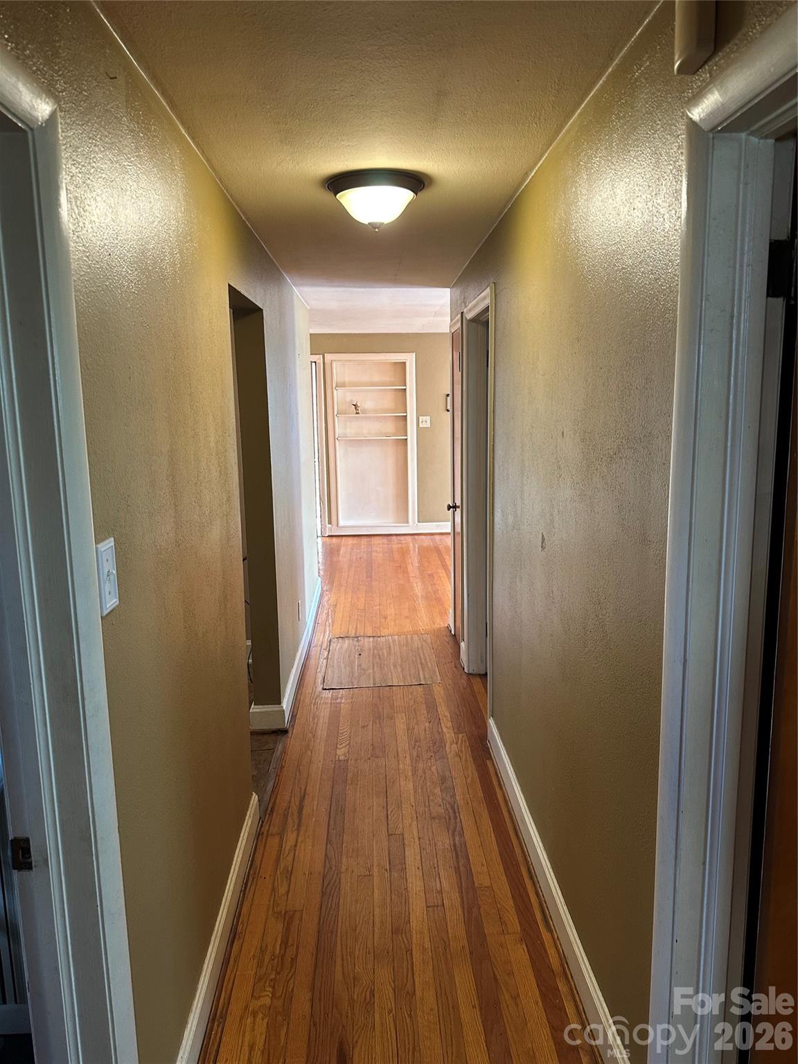 5164 Lavern Street, Unit 1 Conover, NC 28613 - Photo 25 of 28 a view of a hallway with wooden floor