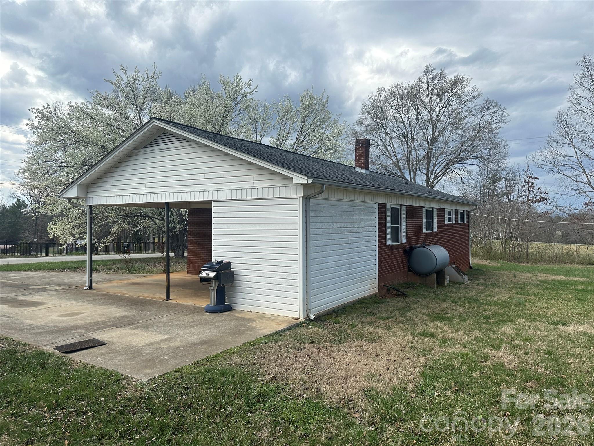 5164 Lavern Street, Unit 1 Conover, NC 28613 - Photo 4 of 28 a view of a house with backyard and a tree