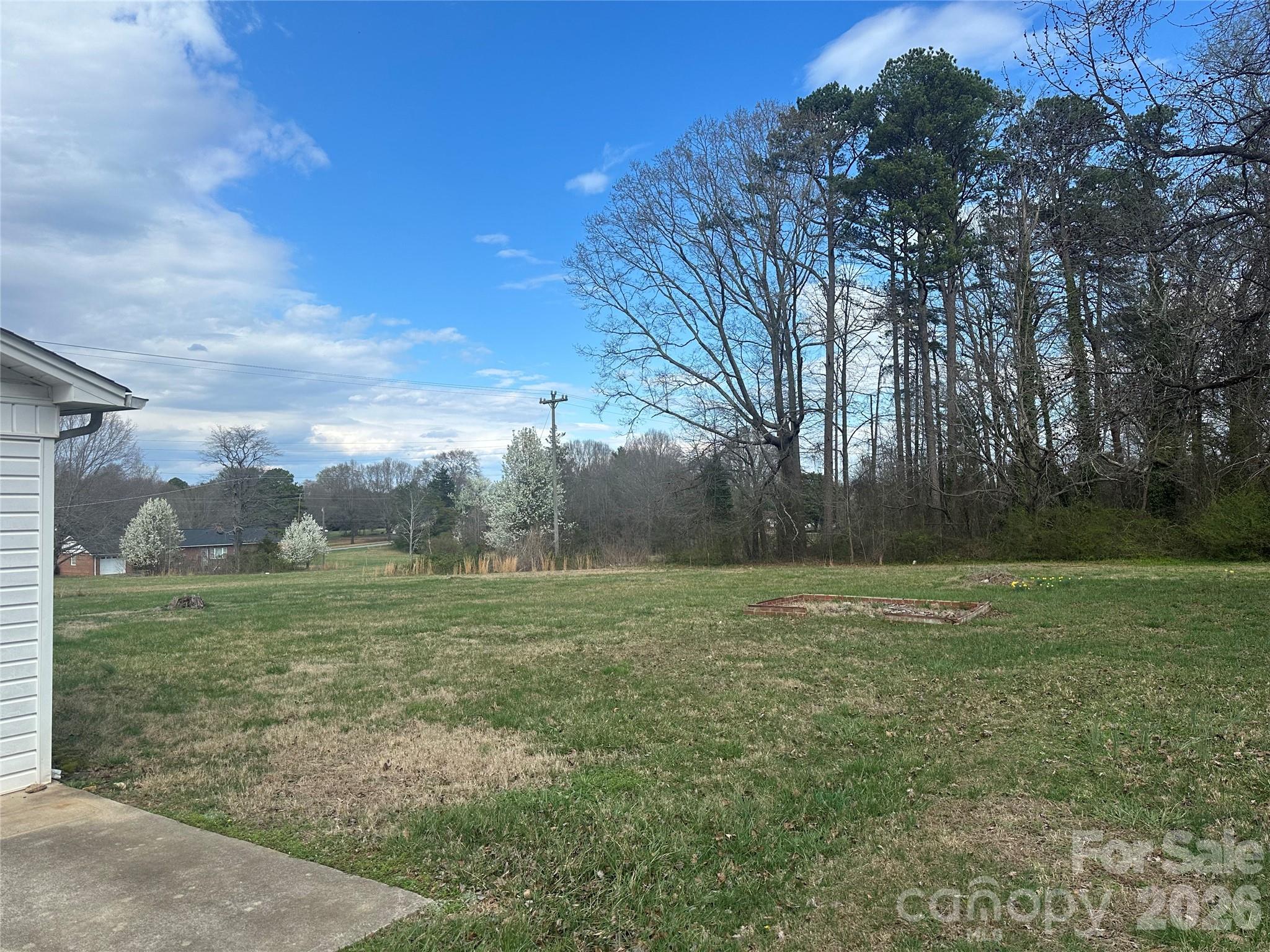 5164 Lavern Street, Unit 1 Conover, NC 28613 - Photo 5 of 28 a view of outdoor space with green field and trees