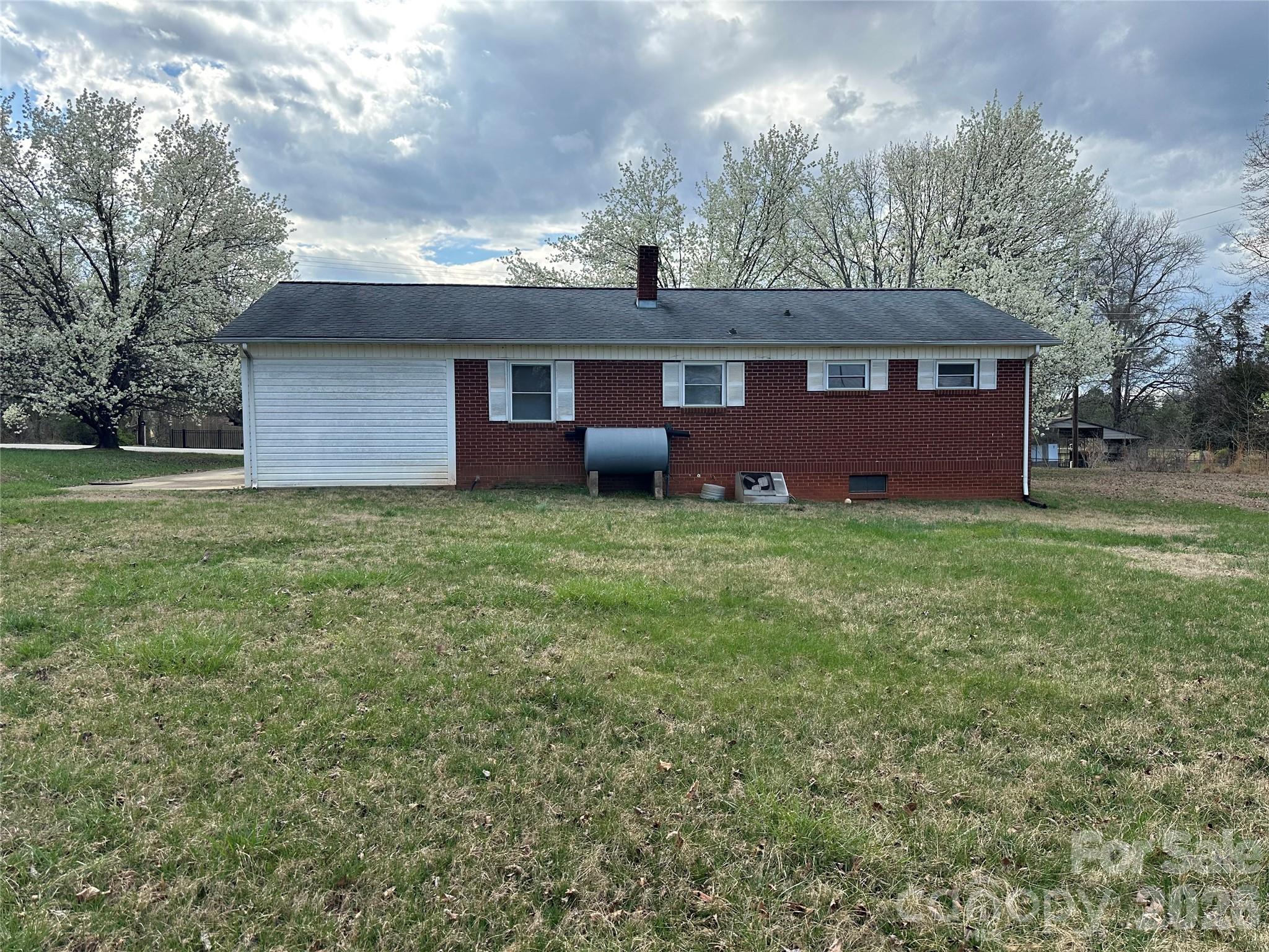 5164 Lavern Street, Unit 1 Conover, NC 28613 - Photo 7 of 28 a view of a house with yard and a tree